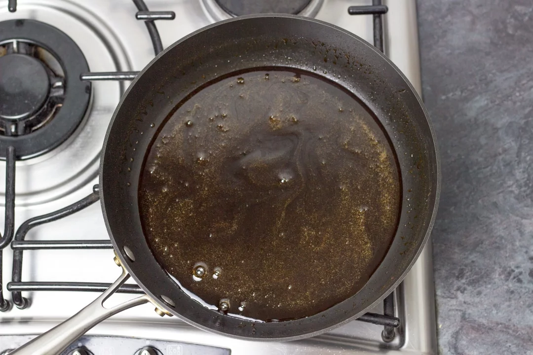 Chicken teriyaki sauce in a large frying pan