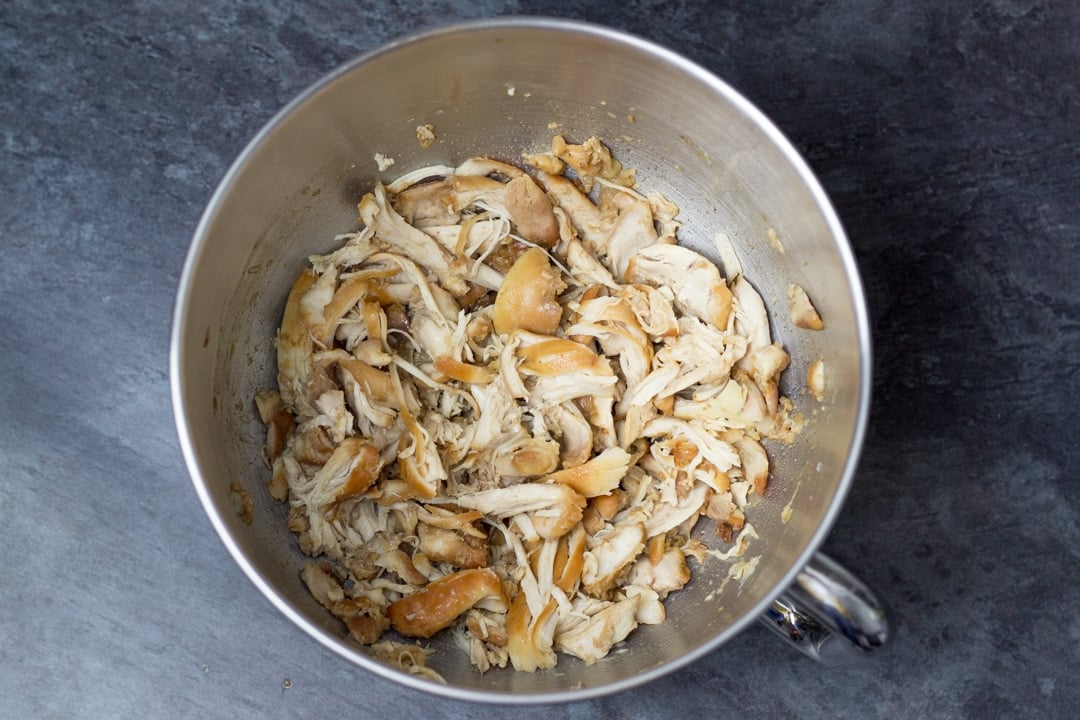 Chicken teriyaki recipe: shredded chicken thighs in a stand mixer bowl