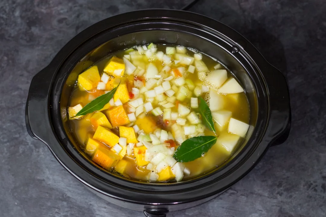 Pumpkin soup ingredients in a slow cooker
