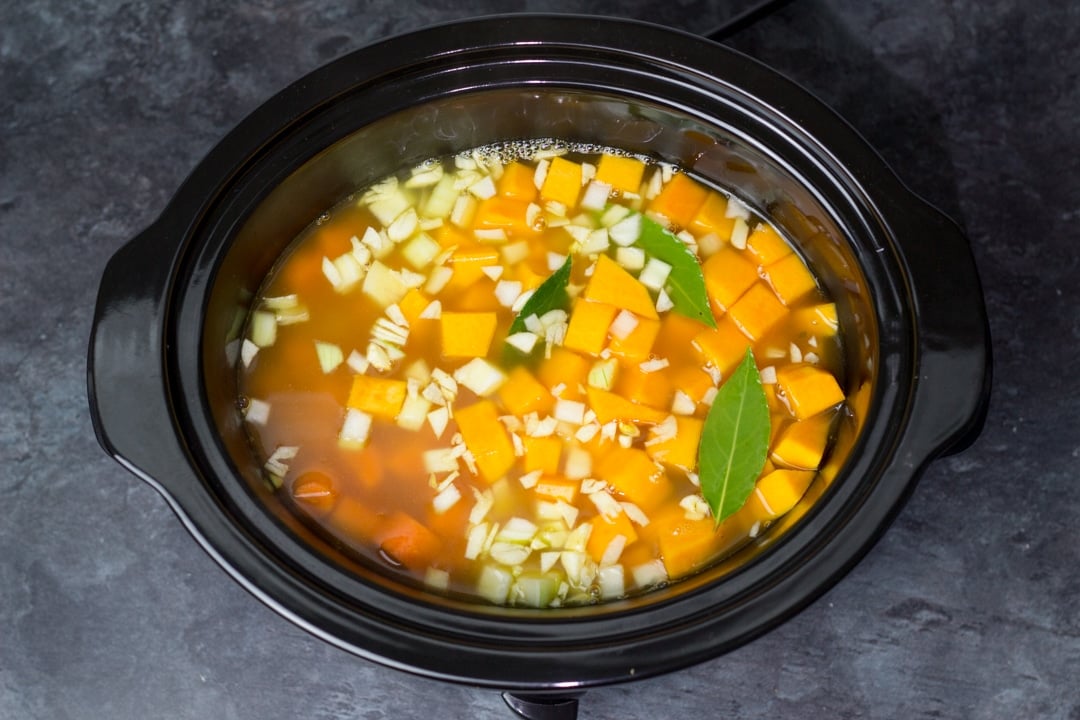 vegetable soup ingredients in a slow cooker