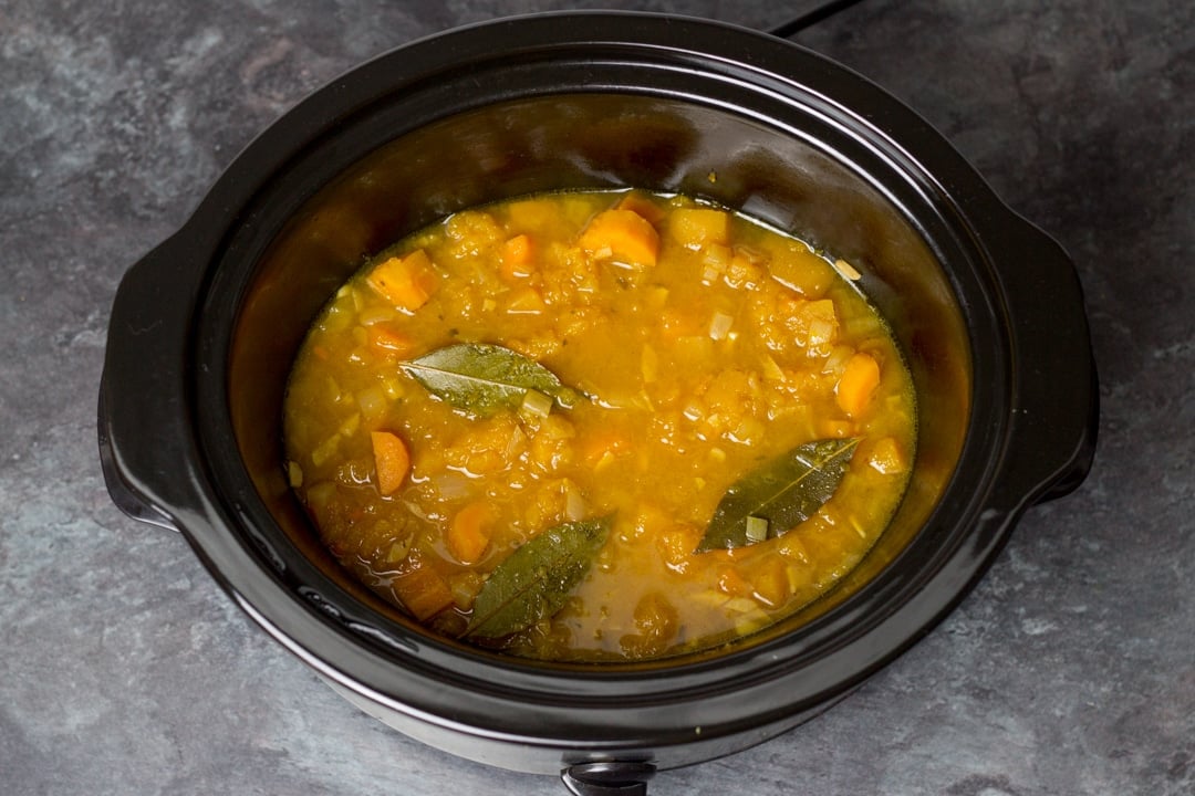 freshly cooked slow cooker vegetable soup in a slow cooker