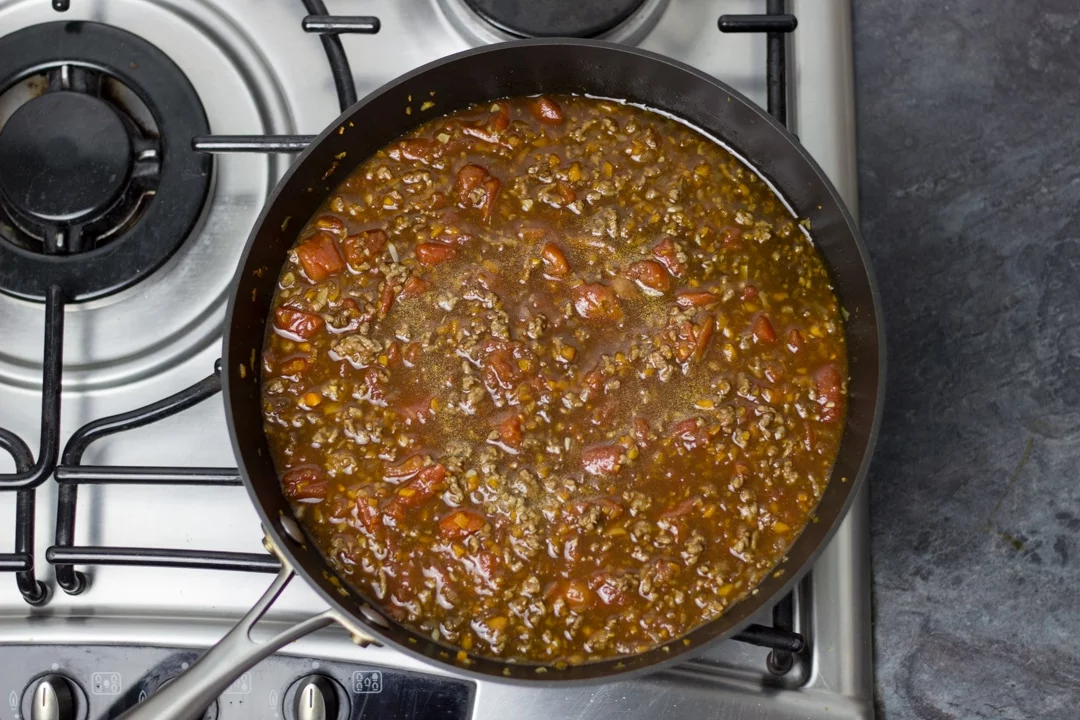 Easy spaghetti bolognese mince cooking in a large saucepan