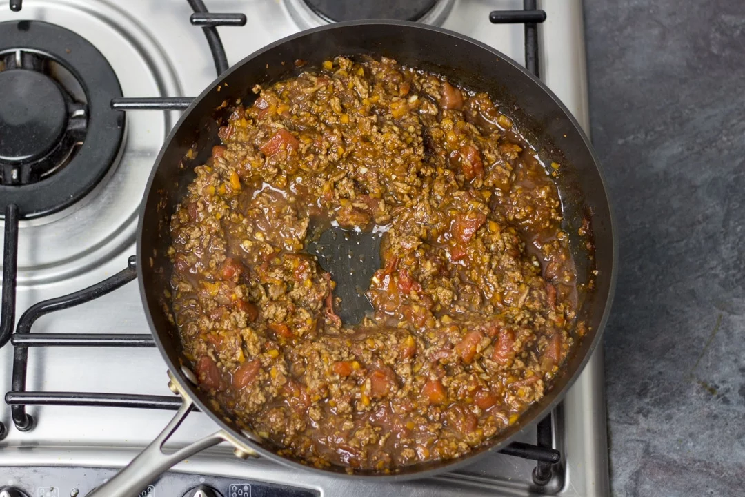 Easy spaghetti bolognese mince cooking in a large saucepan