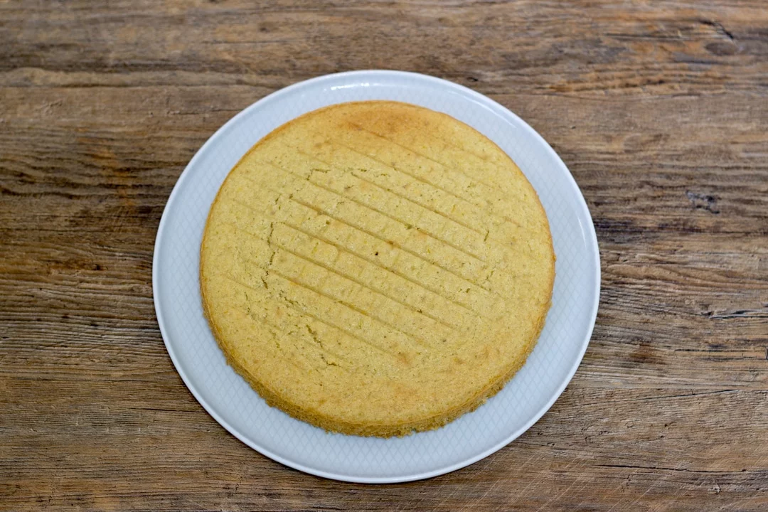 dairy free / vegan lemon bottom cake layer on a plate