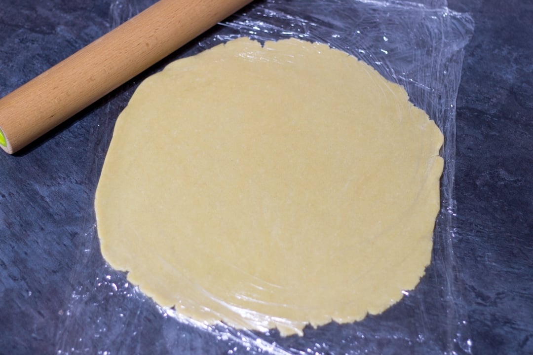 shortcrust pastry rolled out between sheets of cling film