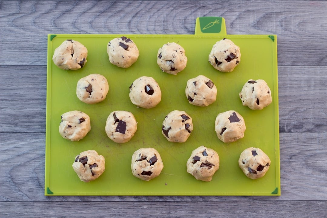 vegan chocolate chip cookie dough balls on a chopping board