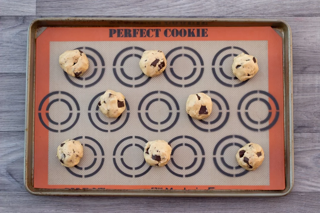 vegan chocolate chip cookie dough balls on a baking tray