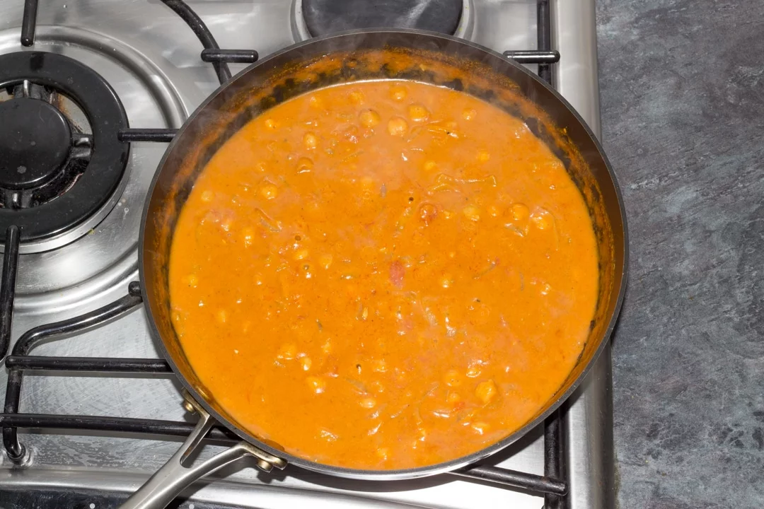 chickpea curry in a saucepan simmering