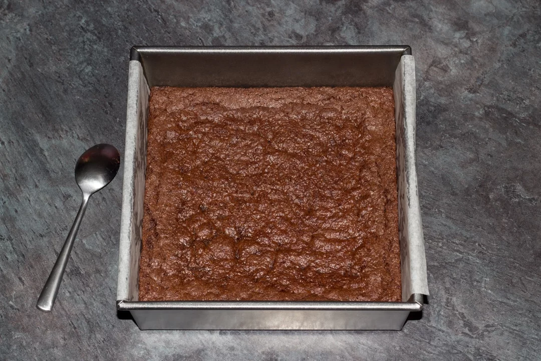 baked vegan gluten free brownies in a baking tin