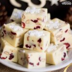 White chocolate pecan cranberry fudge on a plate