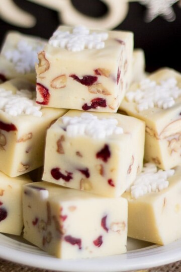 White chocolate pecan cranberry fudge on a plate