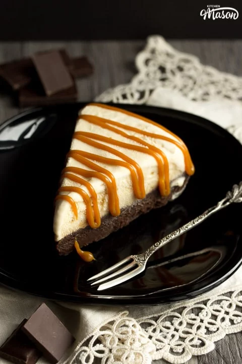 Slice of Salted Caramel Brownie Ice Cream Cake on a black plate