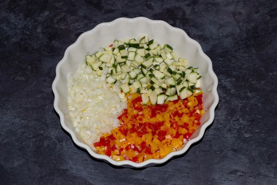 finely chopped vegetables in a baking dish