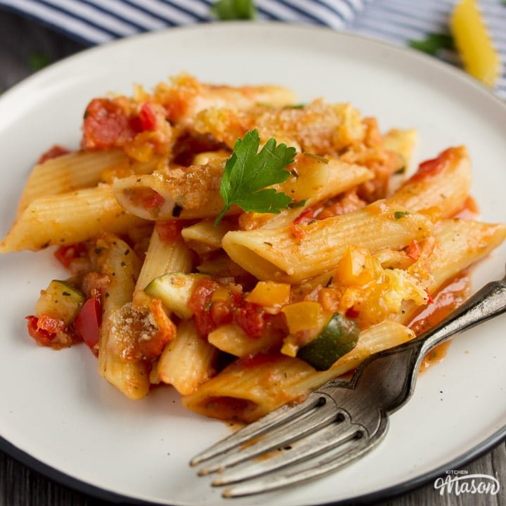 vegetable pasta bake on a plate with a fork