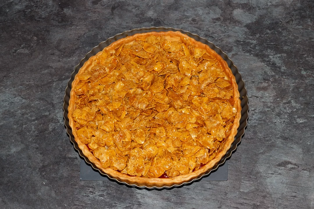 a prepared cornflake tart ready to be baked in the oven