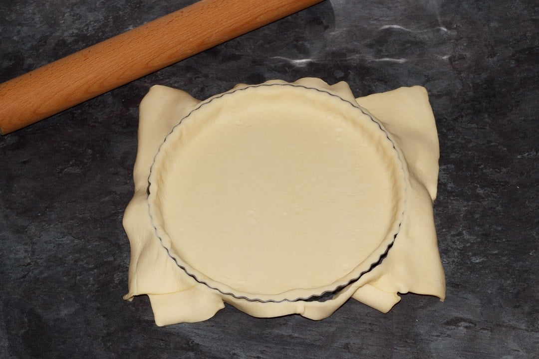 shortcrust pastry draped in a fluted tart tin