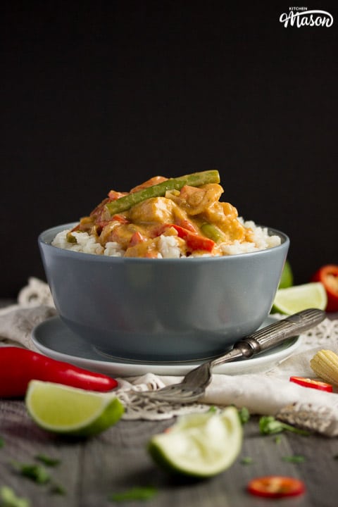 vegetable thai red curry in a grey bowl with rice