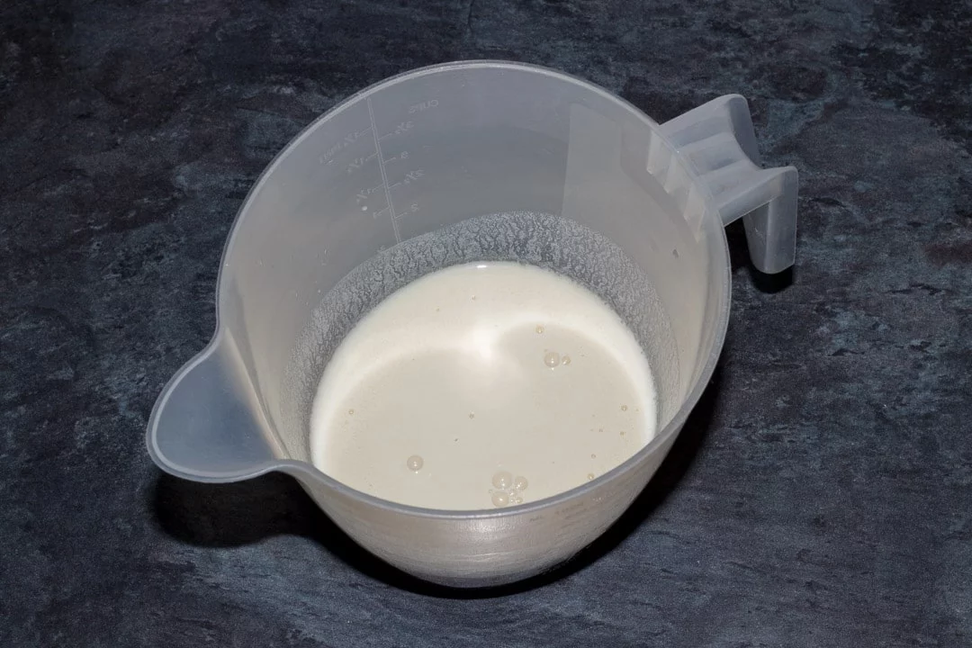 oat milk, white wine vinegar and vanilla in a jug
