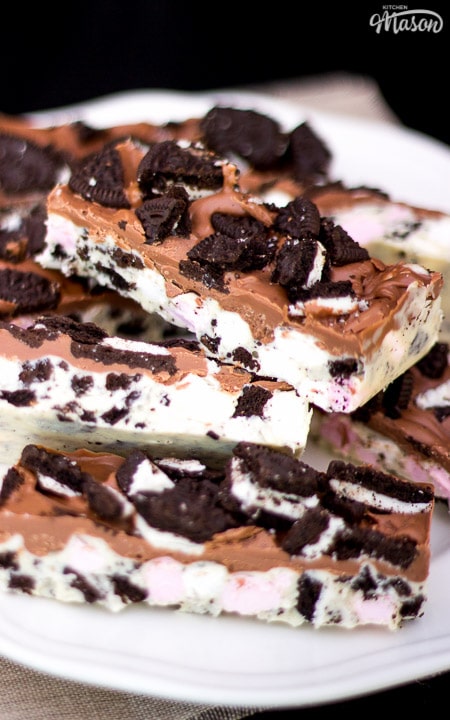 cookies and cream rocky road in a stack topped with broken oreos