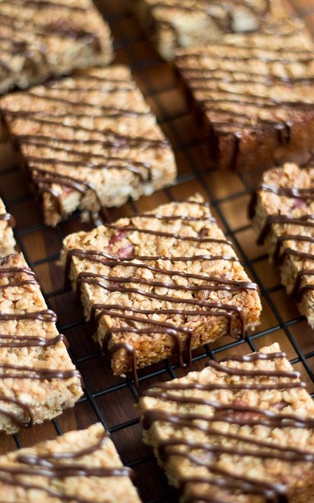 maple pecan flapjacks drizzled with chocolate on a cooling rack