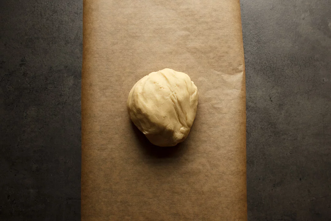 shortbread cookies dough on a sheet of baking paper
