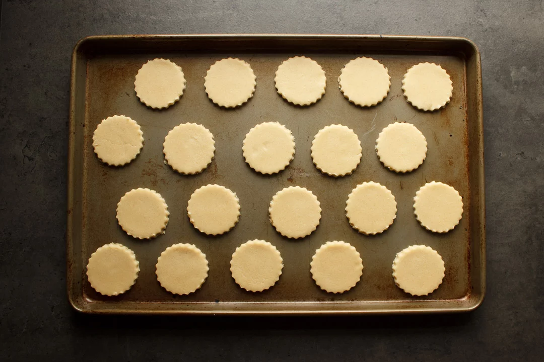 unbaked shortbread cookies spaced out on a baking tray