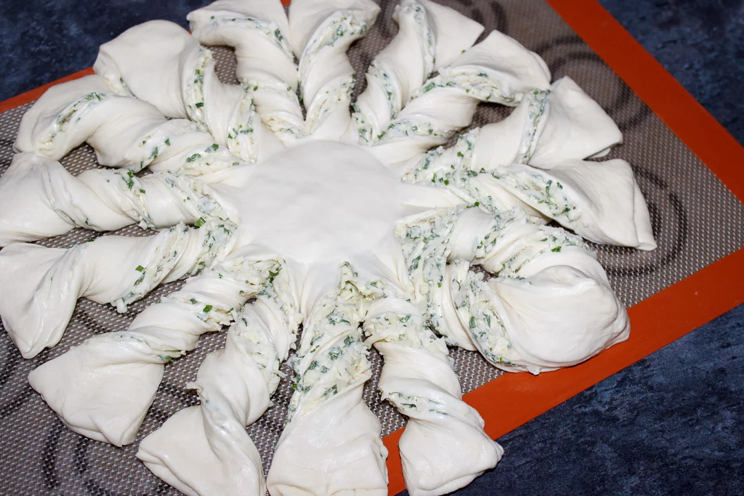 Filled pizza dough that's been twisted to look like a festive star