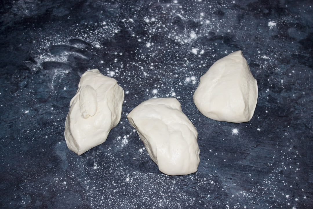 Pizza dough divided into 3 pieces