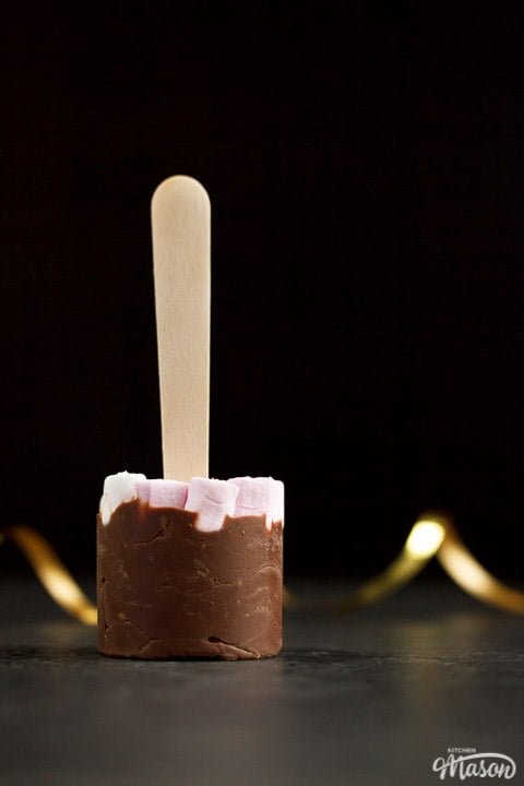 Milk hot chocolate stick topped with mini marshmallows
