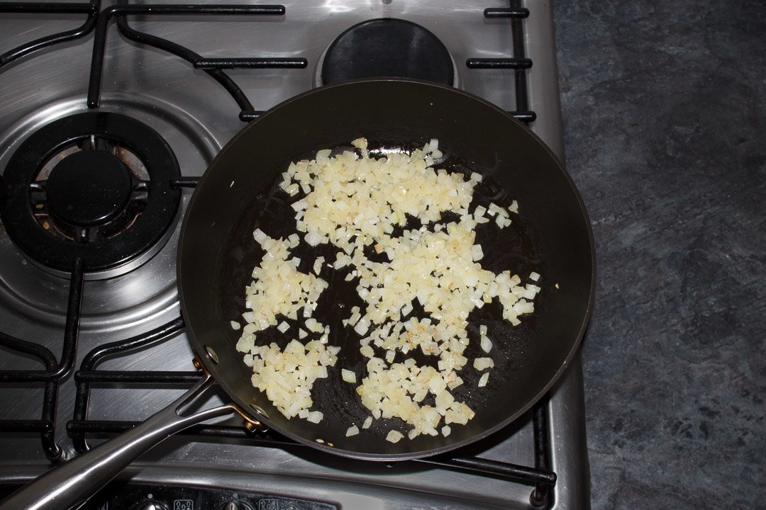frying onion in a pan