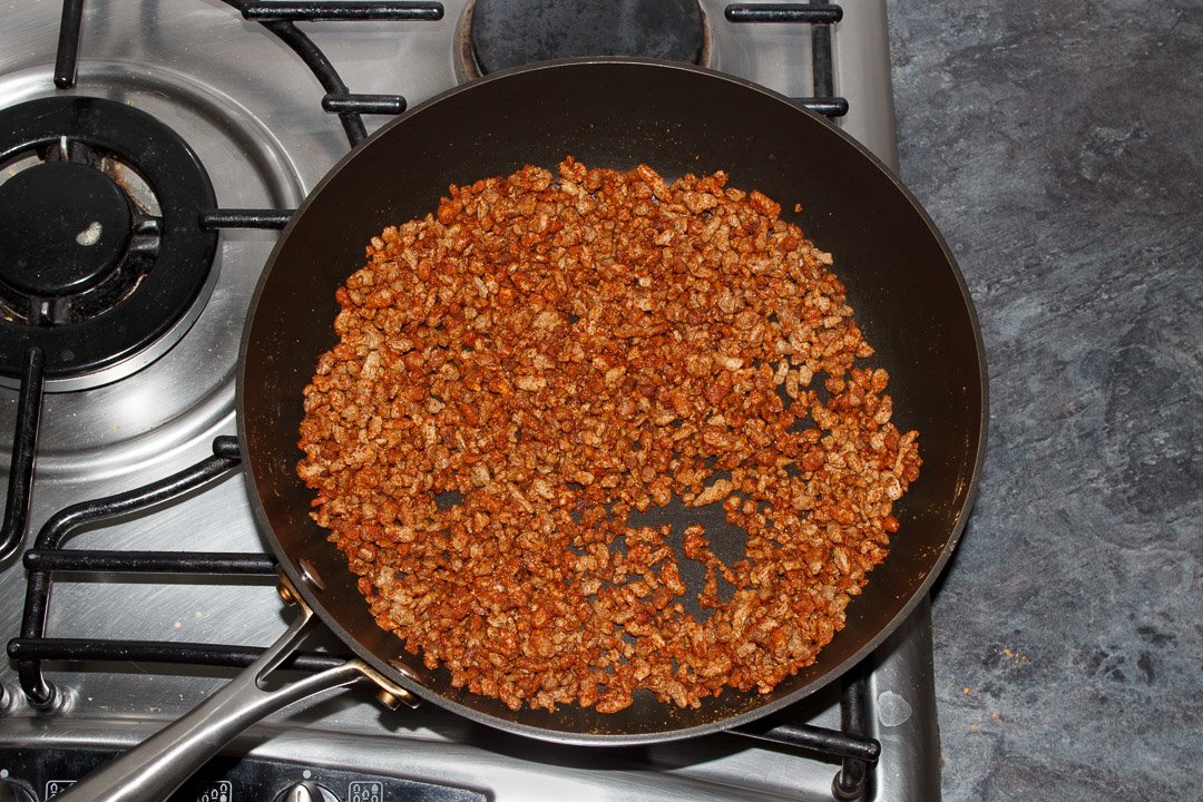 cooked soya mince in a frying pan with taco seasoning