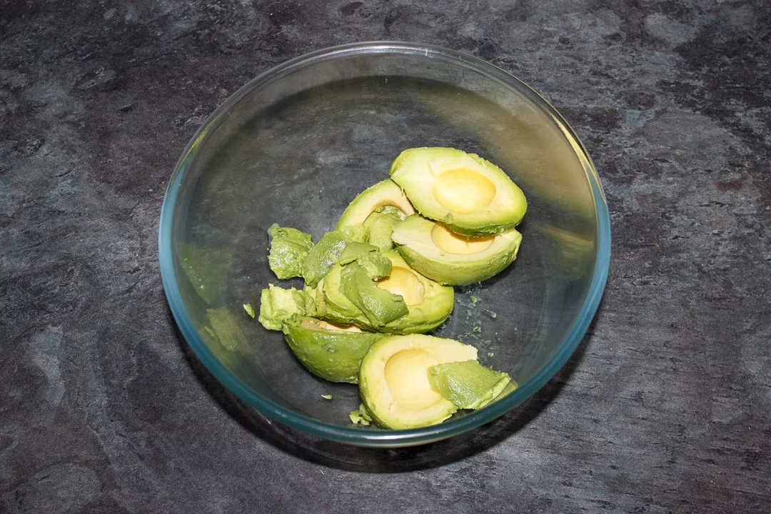 Avocado flesh in a glass bowl