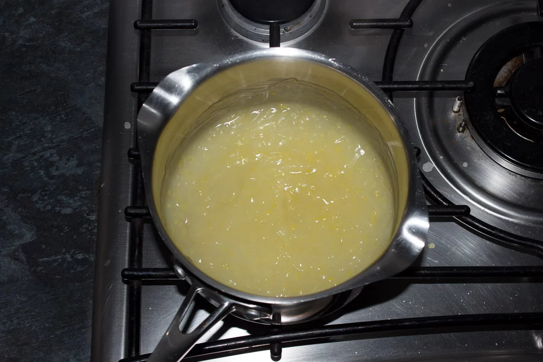 A cornflour, water and lemon mixture in a saucepan set over a hob