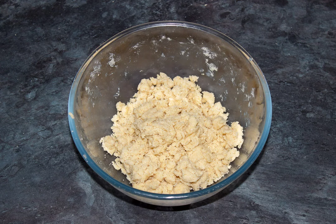 Shortcrust pastry dough in a glass bowl