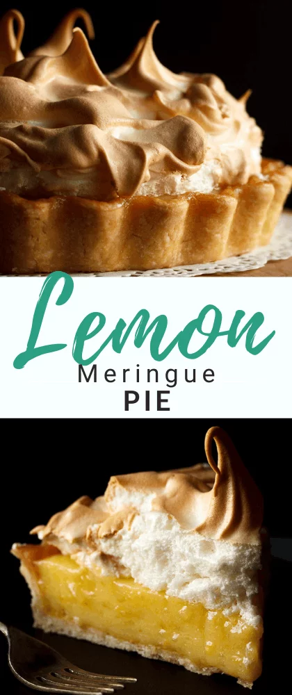 A lemon meringue pie slice on a black plate with a fork