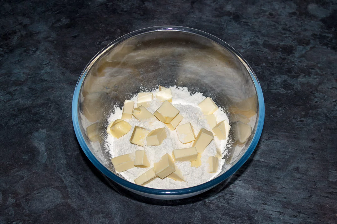 Butter, flour and salt in a glass bowl
