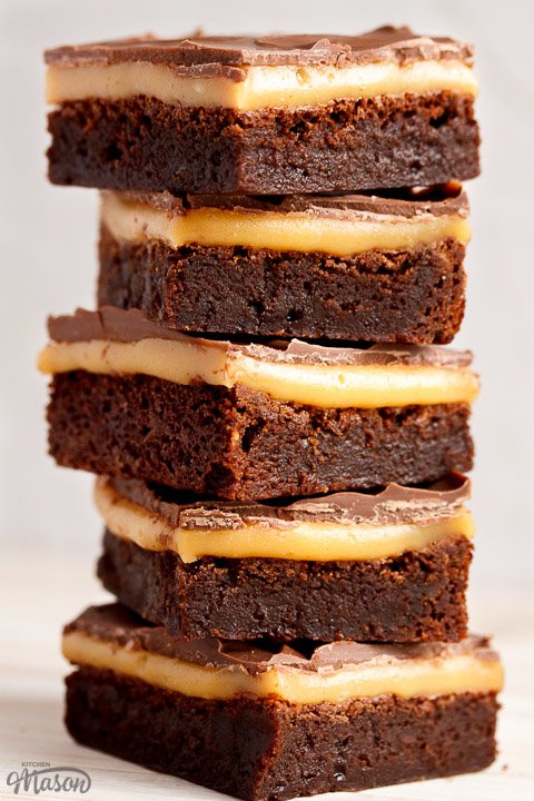 Millionaire brownie bars in a stack