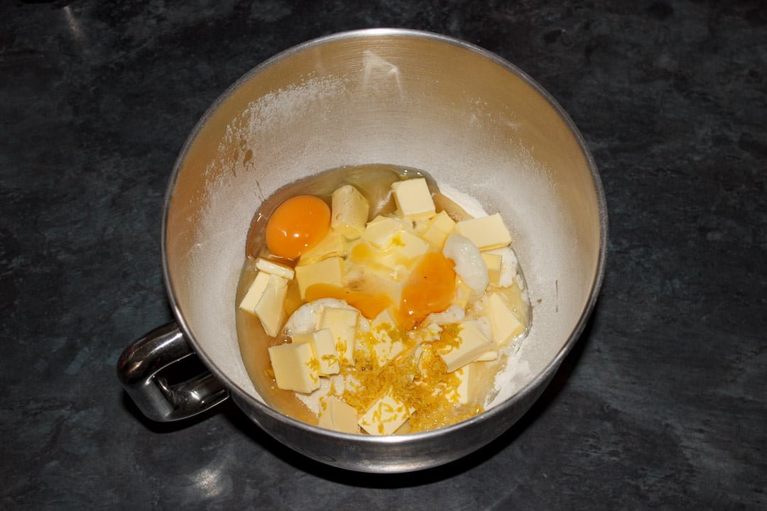 Lemon traybake cake ingredients in the bowl of an electric stand mixer