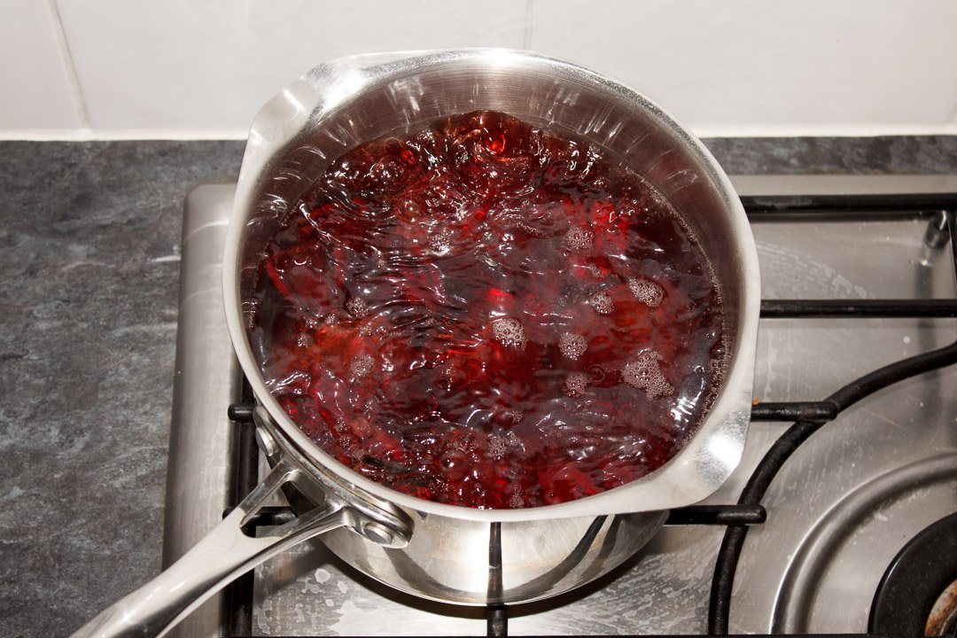 Whole beetroot in a large saucepan of boiling water
