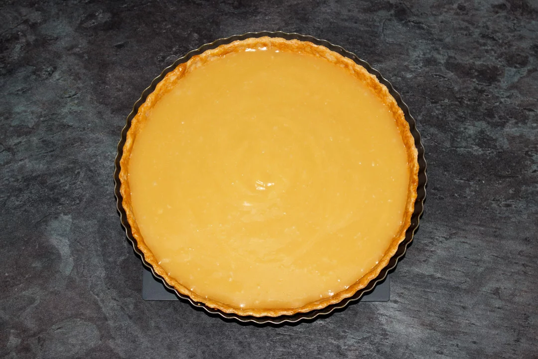 Butterscotch tart in a round fluted tart tin