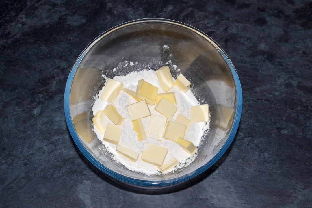 Cubed butter, flour and salt in a glass bowl