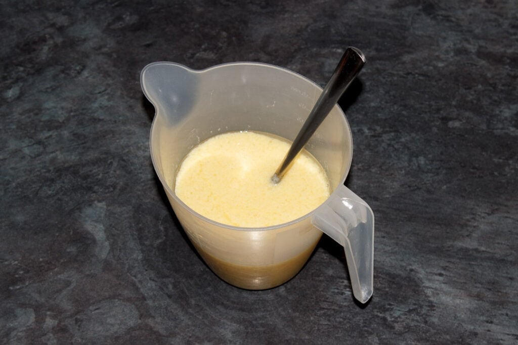 Carrot cake loaf wet ingredients in a jug.
