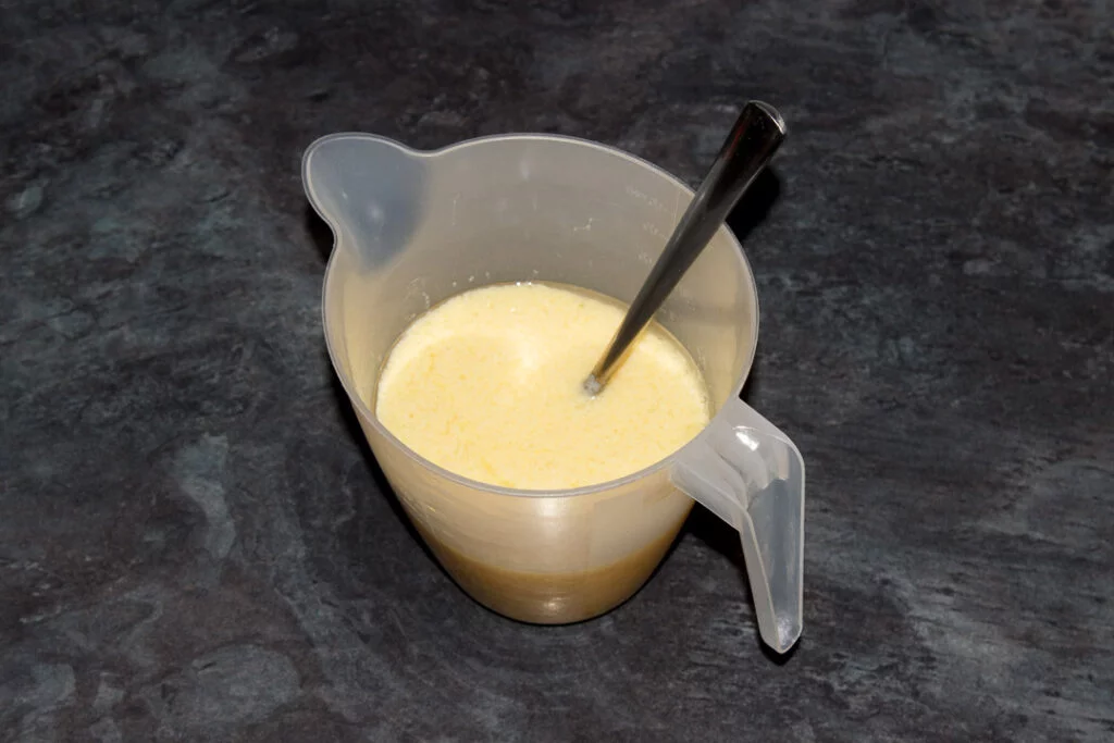 Carrot cake loaf wet ingredients in a jug.