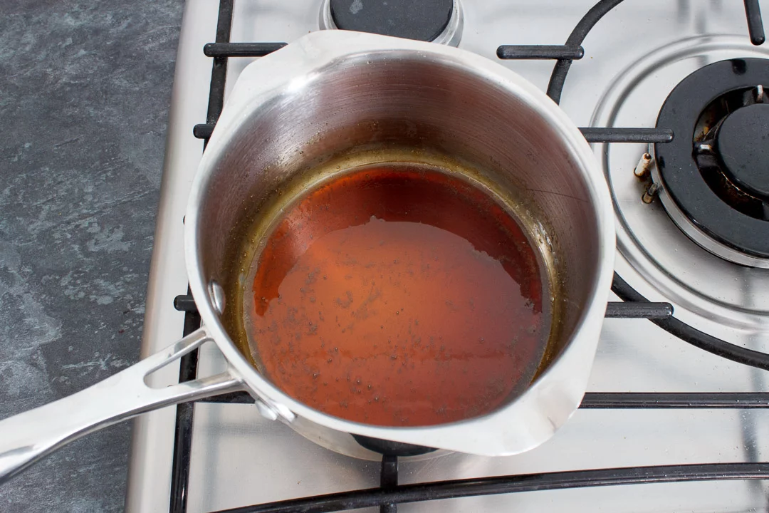 Soy sauce, mirin and caster sugar simmering in a small saucepan