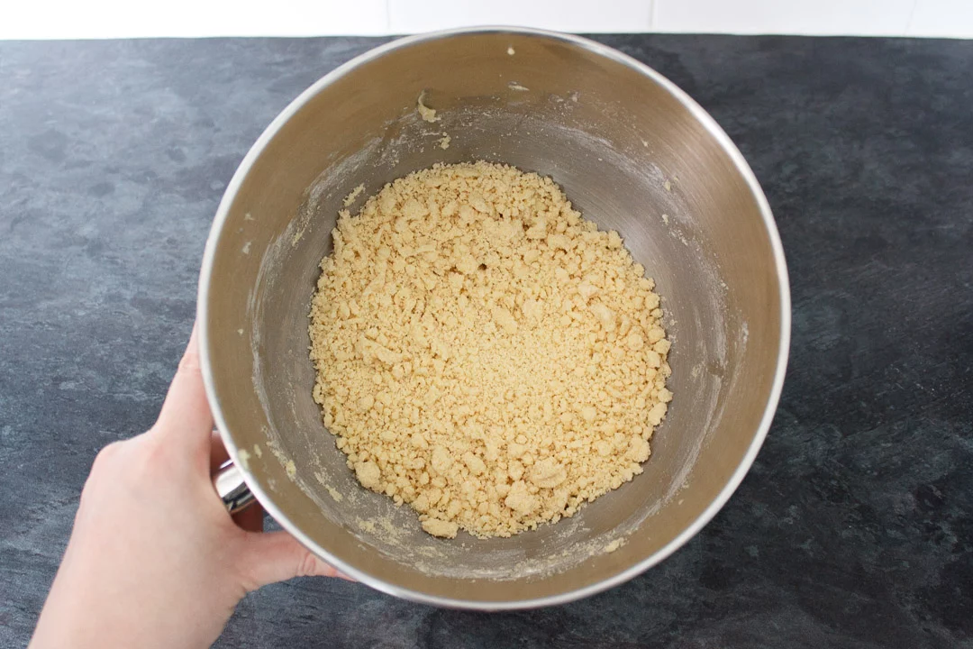 shortbread biscuit base dough in the bowl of an electric stand mixer