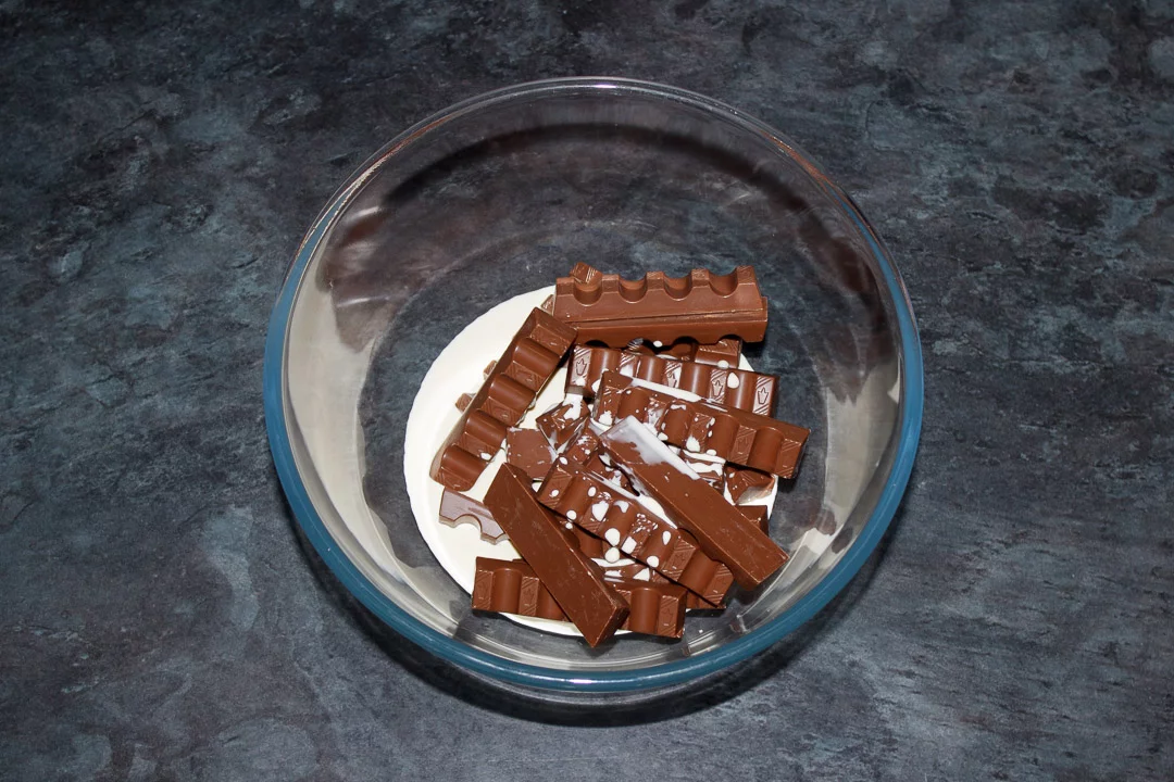 Double cream and Kinder bars in a glass bowl