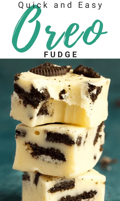 Oreo fudge in a stack of 3, the top piece has a bite out of it