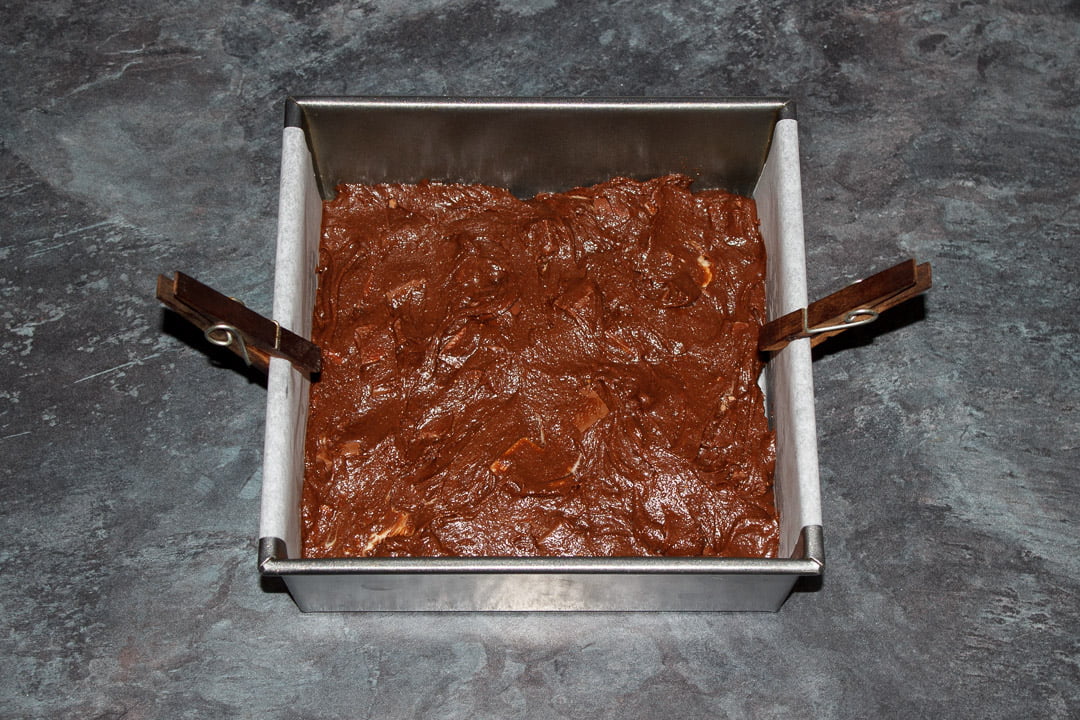 Kinder Bueno Brownie batter in a lined square baking tin