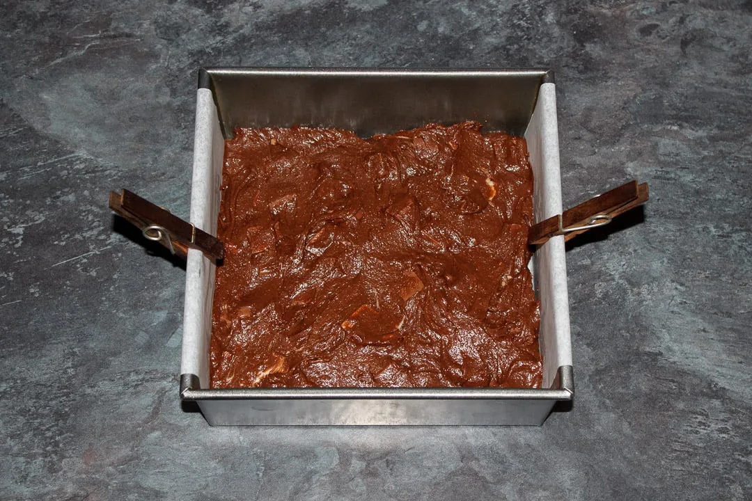 Kinder Bueno Brownie batter in a lined square baking tin