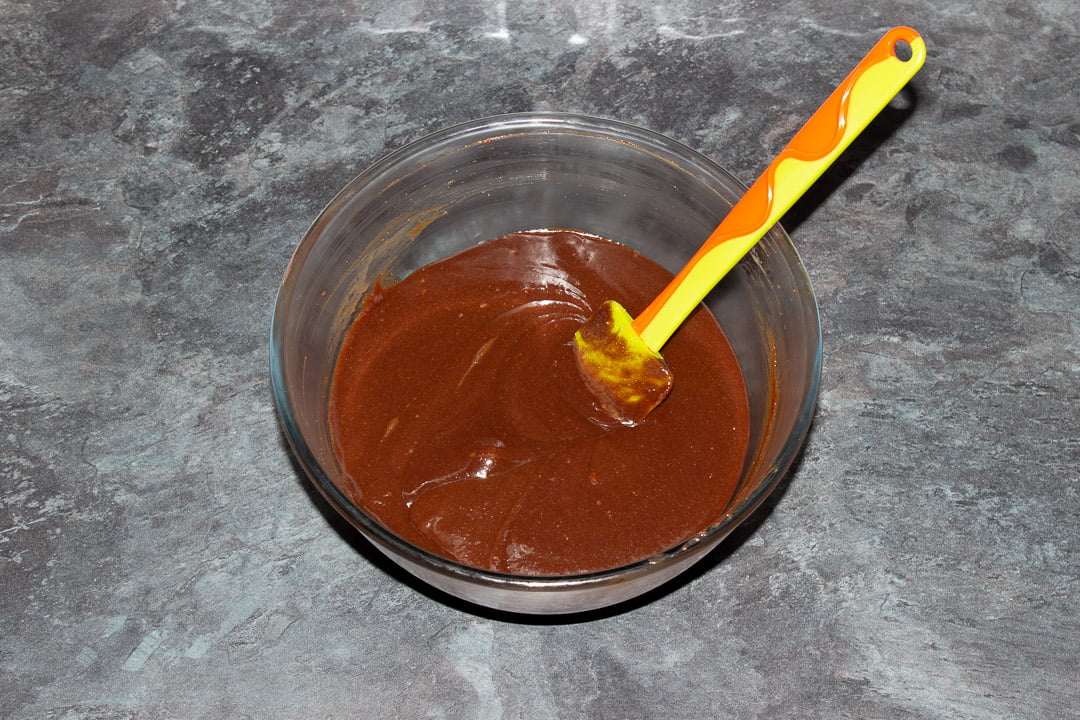 Melted dark chocolate, butter, eggs, sugar, vanilla and salt beaten together in a glass bowl with a rubber spatula